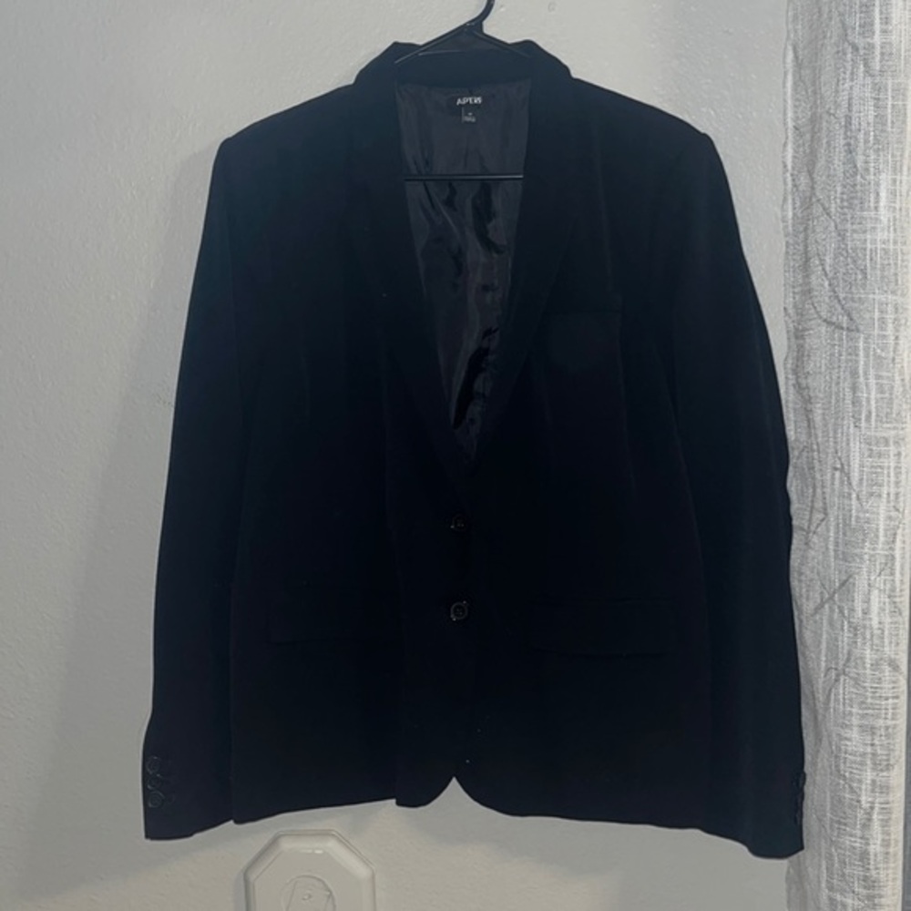 Black suit jacket with pockets and sleeve button details